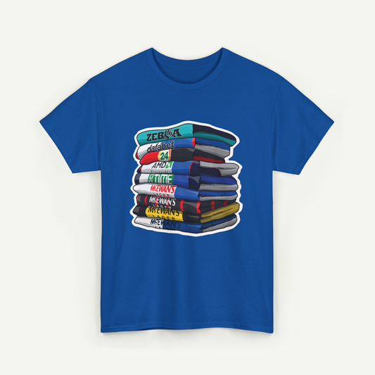 A blue t-shirt with a graphic design depicting a stack of colorful books.