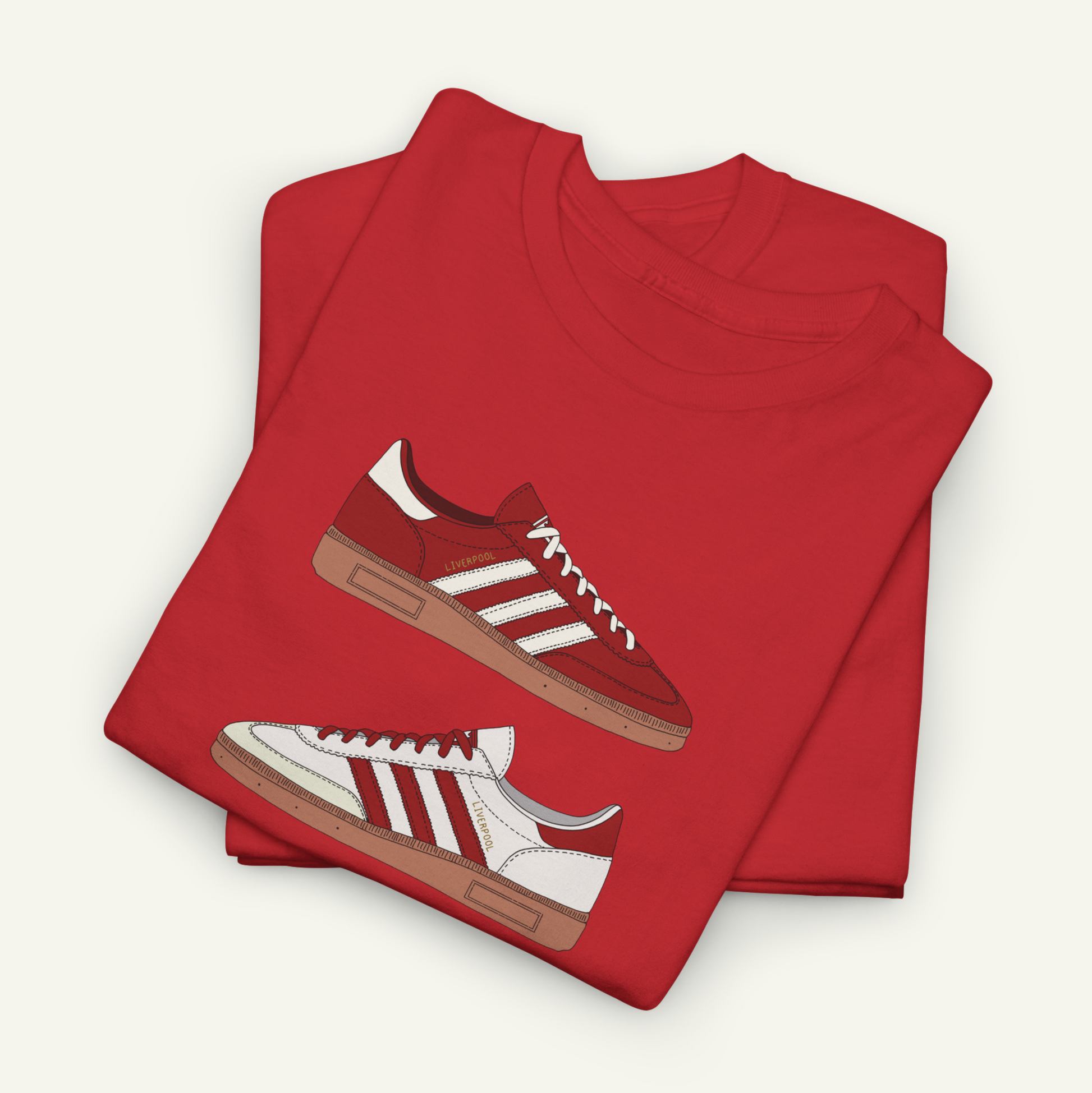 a red t-shirt with a graphic design of a red and white Adidas sneaker printed on it.