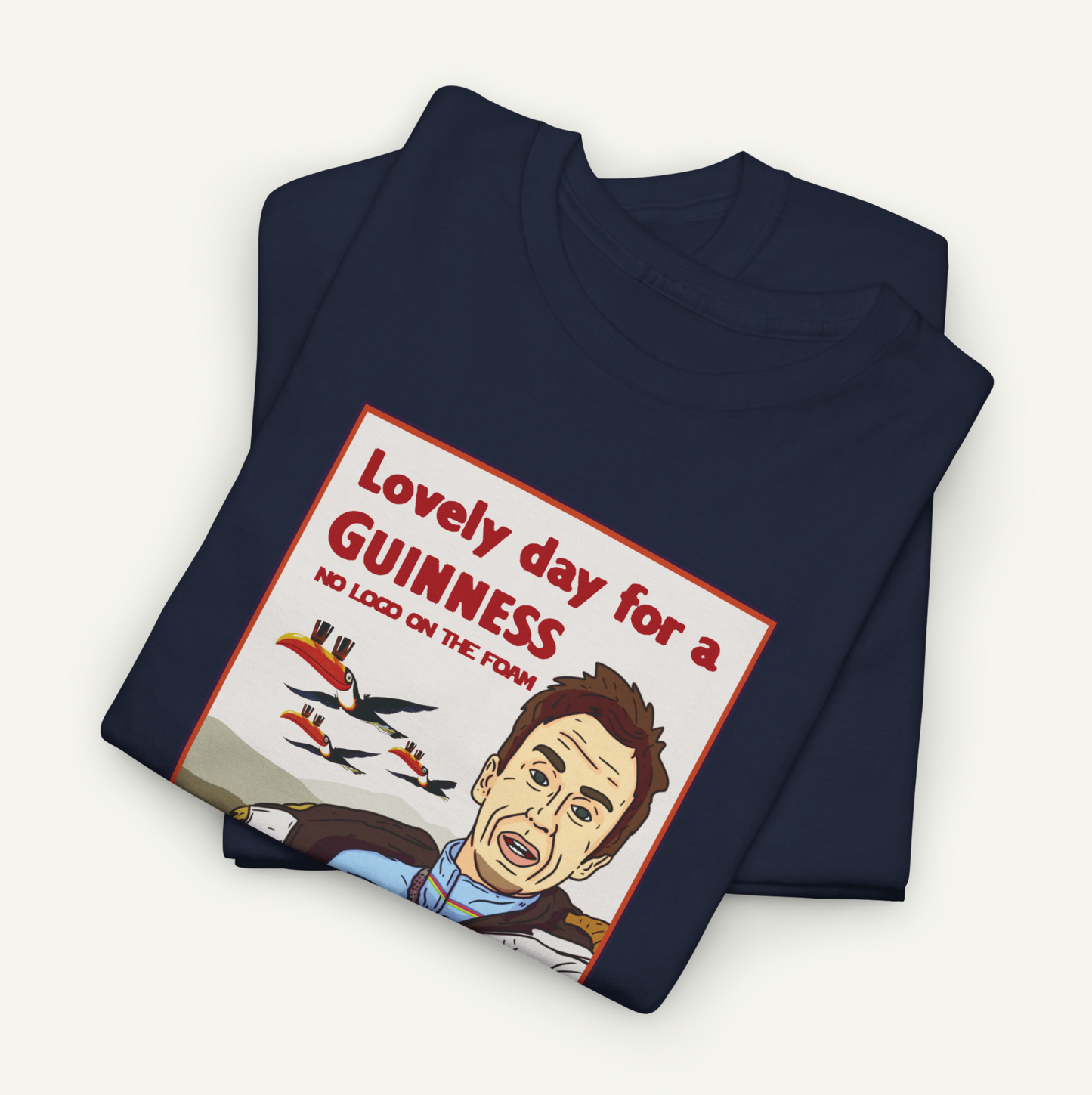 a dark blue t-shirt with a graphic design depicting a man's face and the text "Lovely day for a Guinness" printed on it.