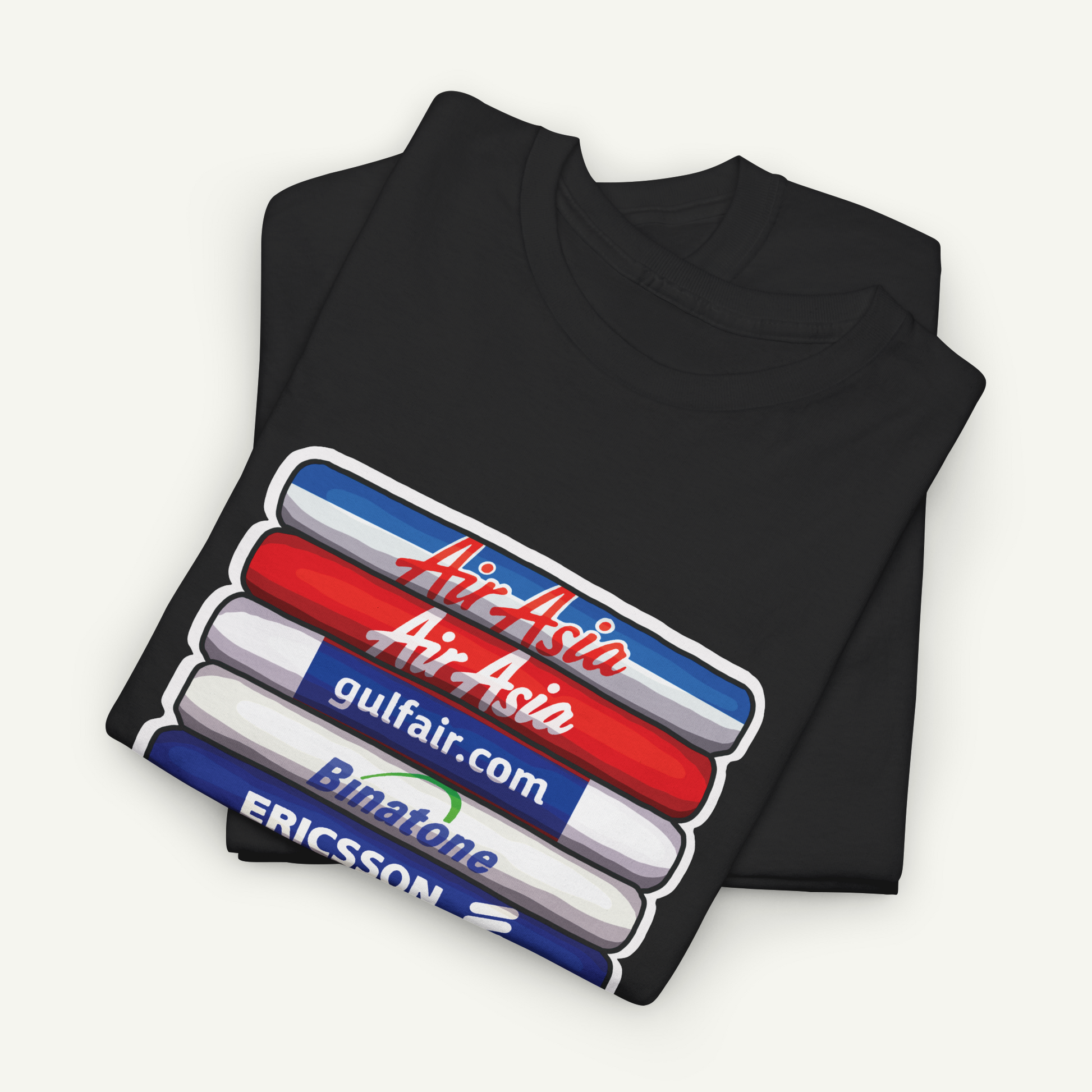 A black t-shirt with a graphic design featuring a stack of three colored markers, each with a different company logo printed on it.