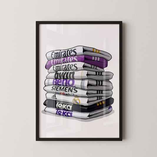 A framed illustration of a stack of towels with various logos and text on them.