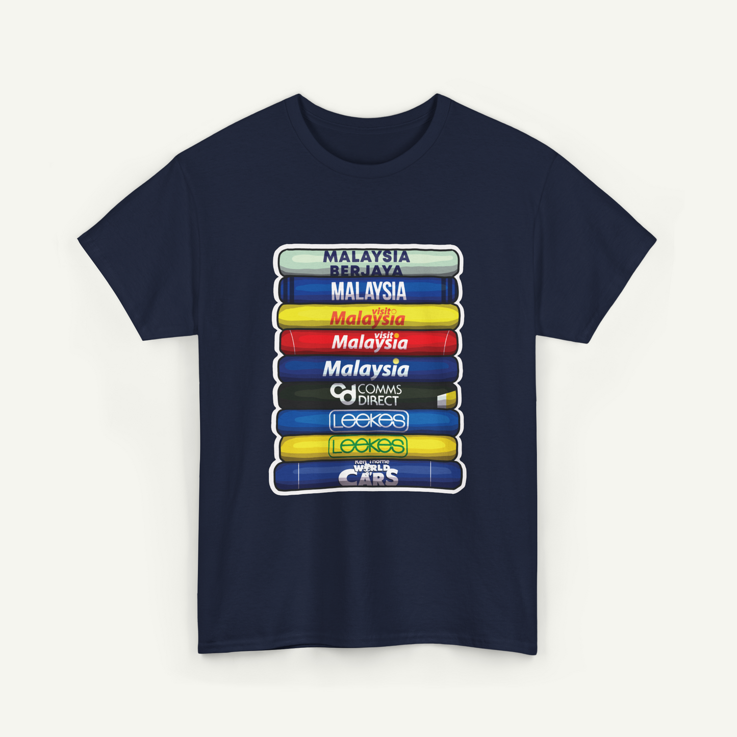 A navy blue t-shirt with a graphic design depicting a stack of colorful books or magazines, each with a different country or region name printed on it.