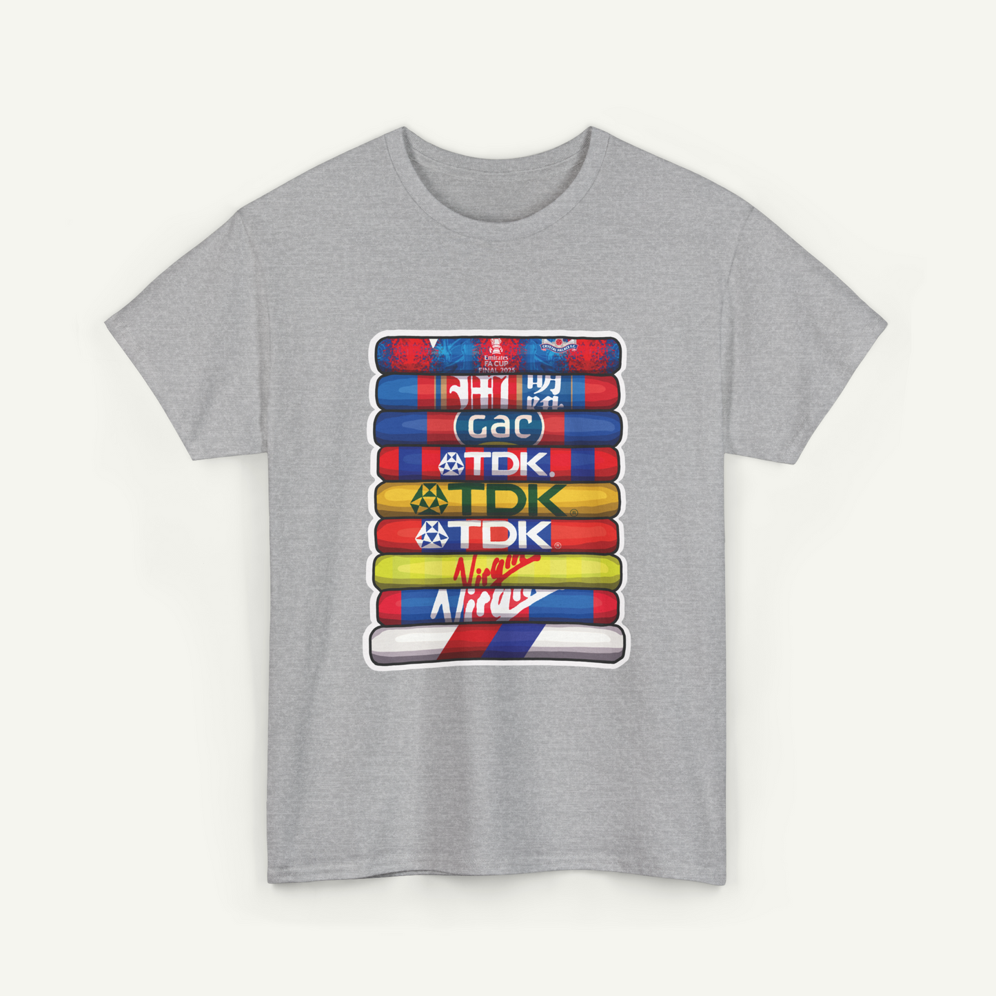 A gray t-shirt with a graphic design featuring a stack of colorful tubes or bottles, each with a different logo or text on it.
