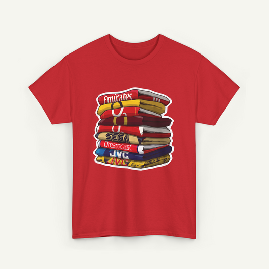 A red t-shirt with a graphic design depicting a stack of colorful books or magazines.