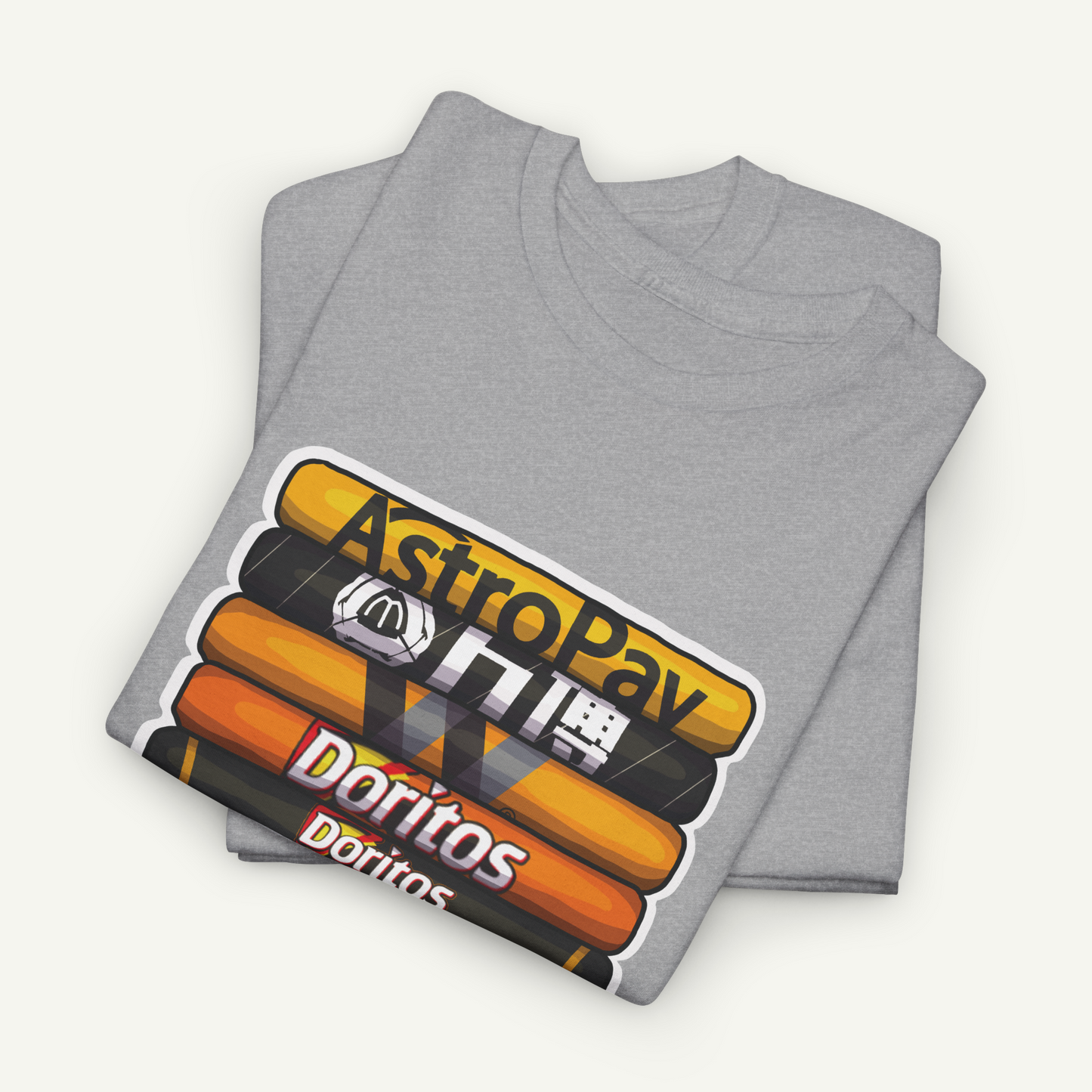 A gray t-shirt with a graphic design featuring stacked orange and yellow Doritos bags, along with the text "AstroPay" and "Doritos" printed on it.