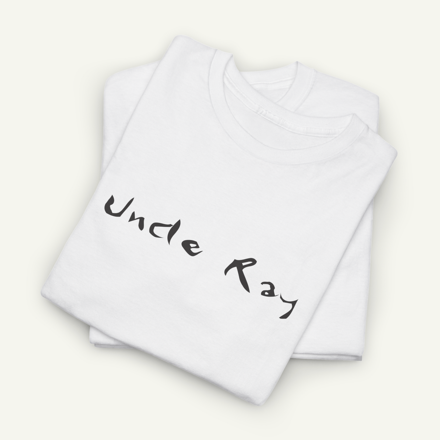 a white t-shirt with the text "Uncle Ray" printed on it.