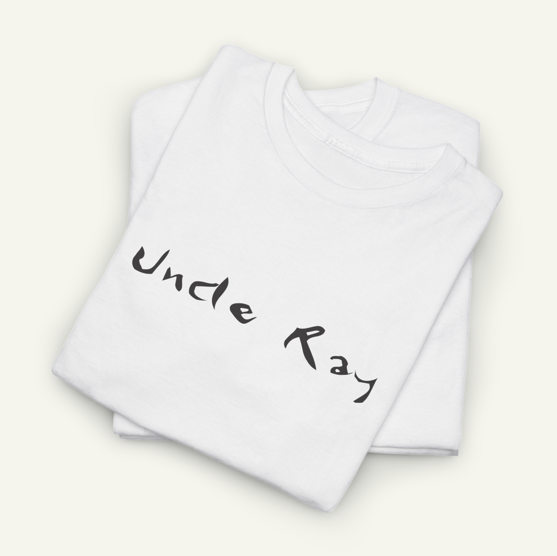 a white t-shirt with the text "Uncle Ray" printed on it.