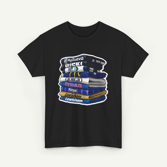 A black t-shirt with a graphic design depicting a stack of books with various colored covers, each book labeled with a different name.