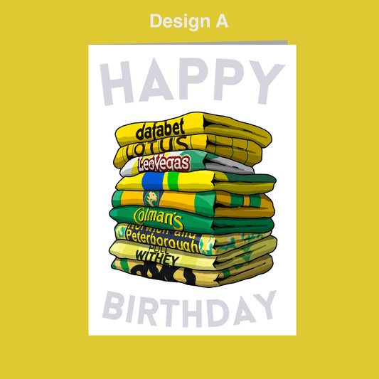 A stack of colorful towels with the text "Happy Birthday" written on them.