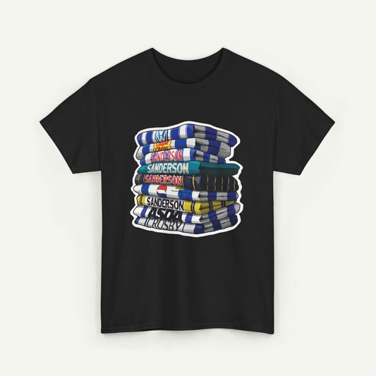 A black t-shirt with a graphic design depicting a stack of colorful books or magazines.