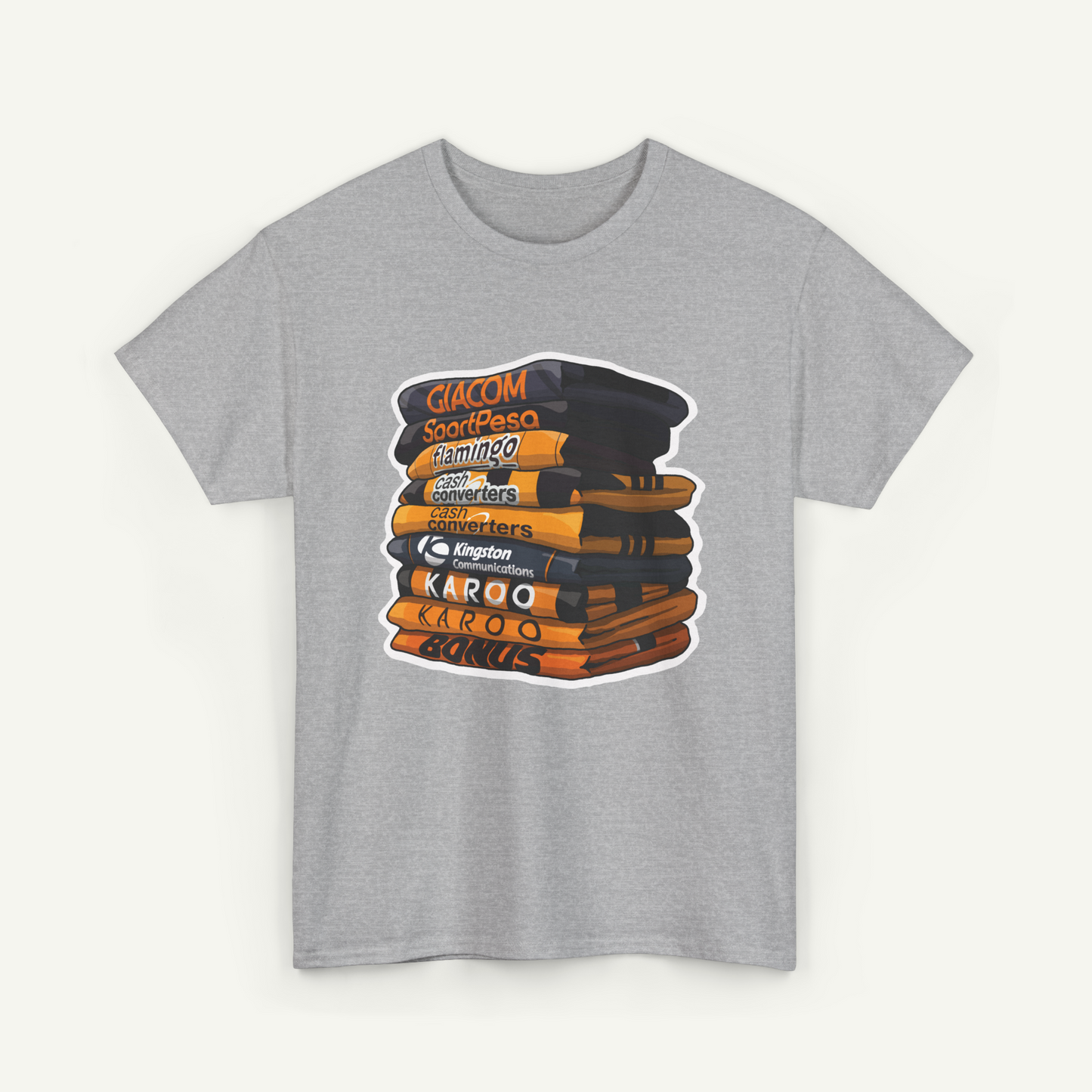 A gray t-shirt with a graphic design depicting a stack of books or magazines with various text labels on the covers.