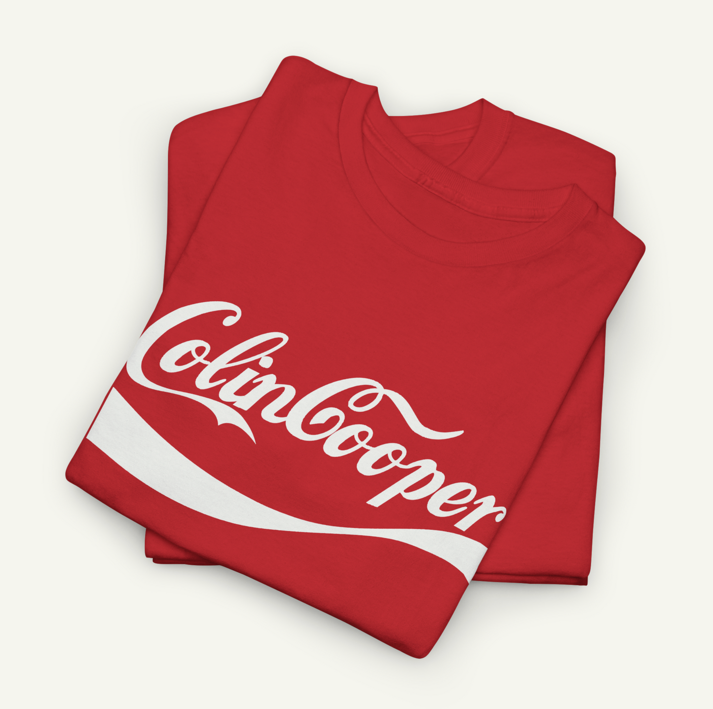 A red t-shirt with the text "Colin Cooper" printed on it.