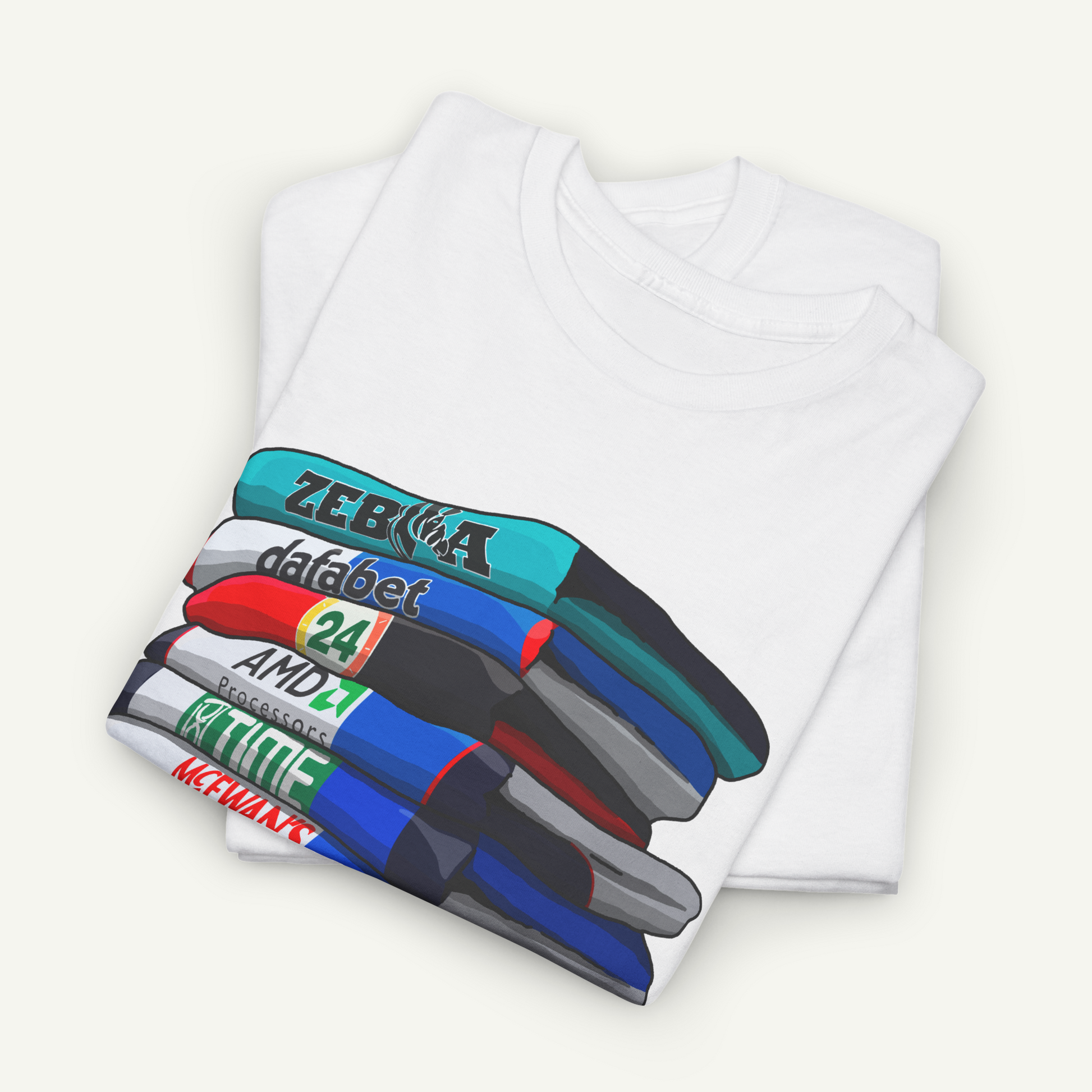 A white t-shirt with a colorful graphic design depicting a stack of books or magazines.