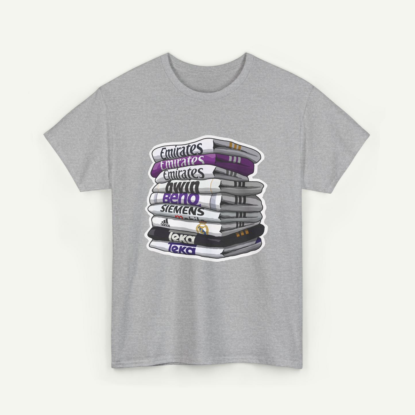 A gray t-shirt with a graphic design depicting a stack of books with various text labels on the spines.