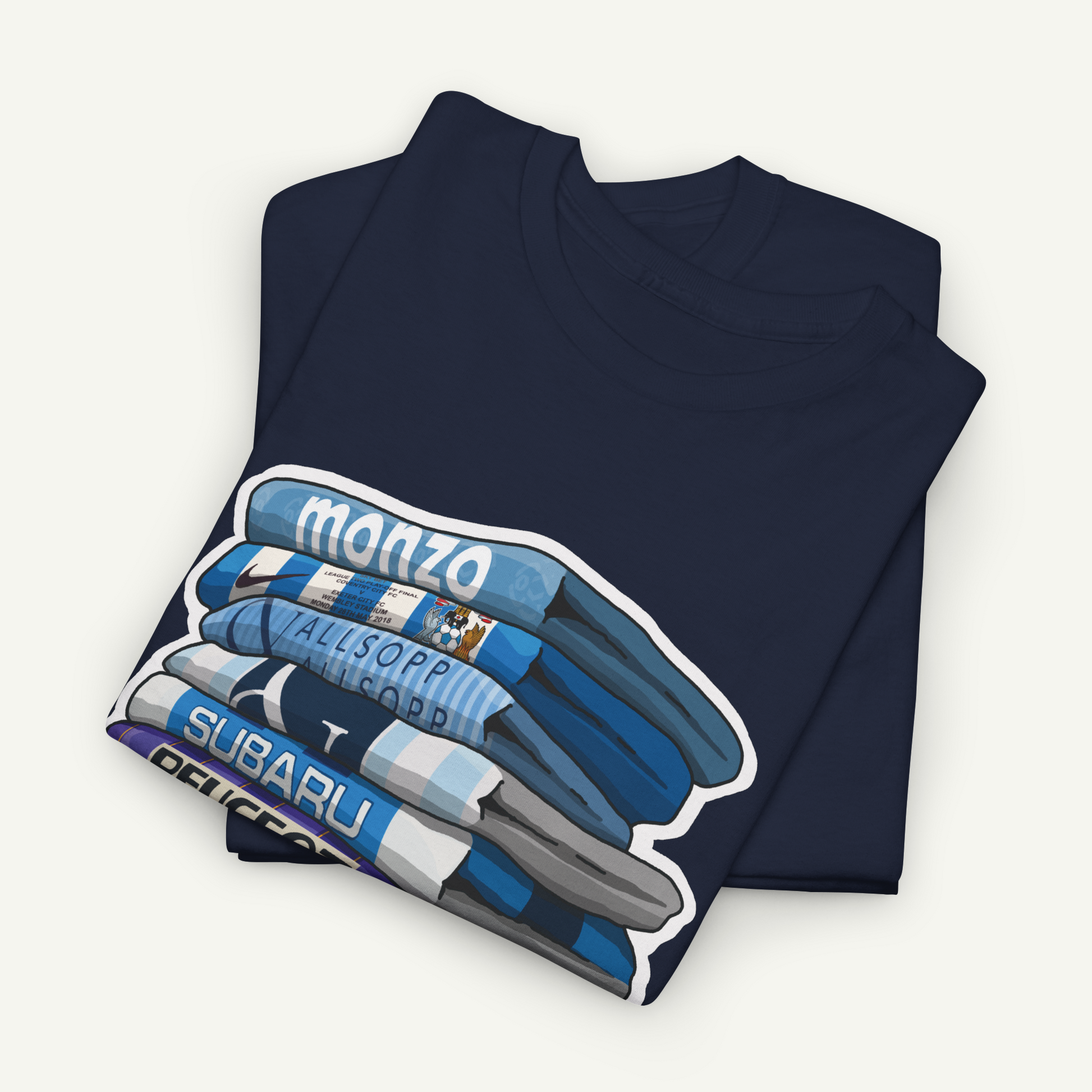 A navy blue t-shirt with a graphic design depicting a stack of blue and white striped shirts, with the word "monzo" written on the top shirt.