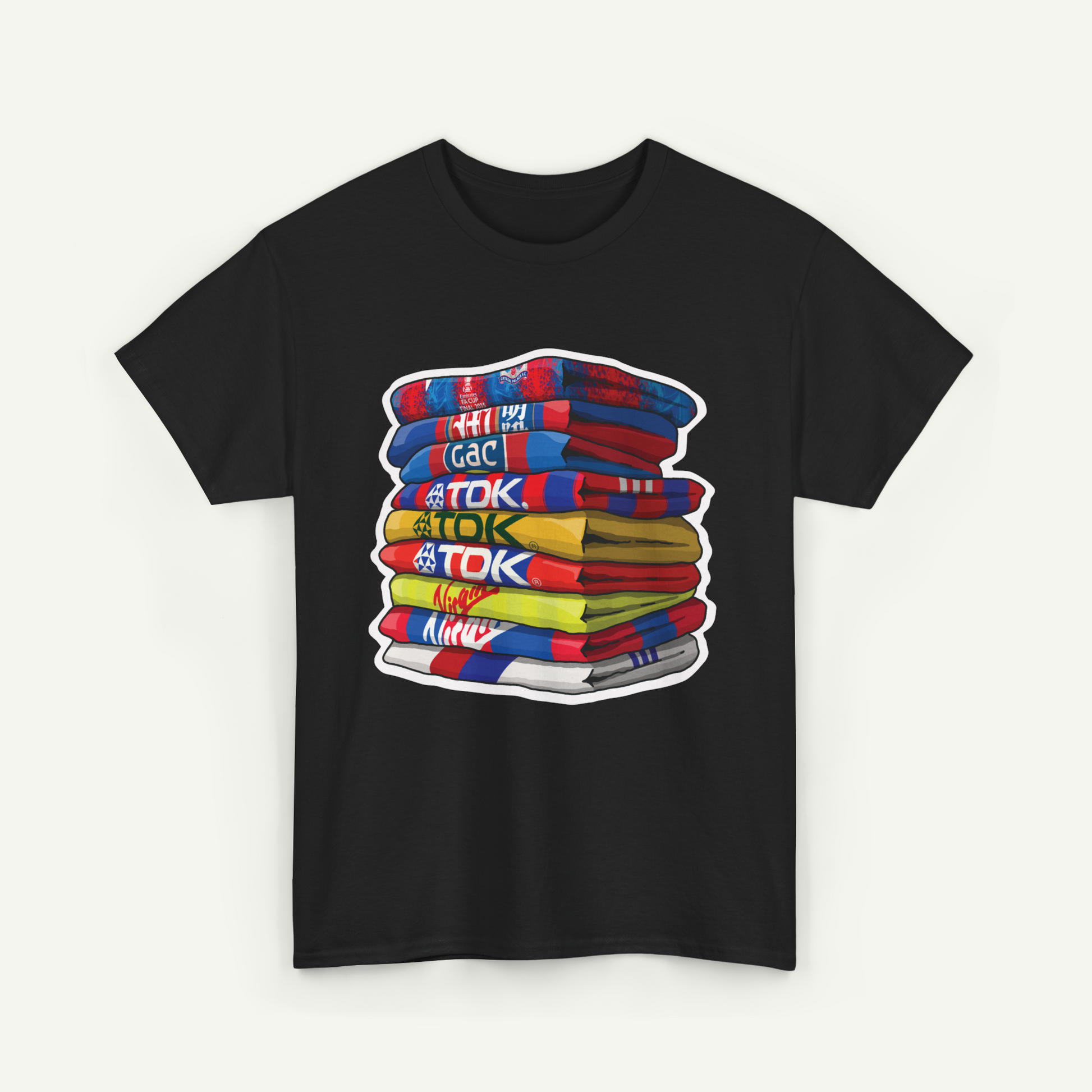 A black t-shirt with a colorful graphic design depicting a stack of books or books.