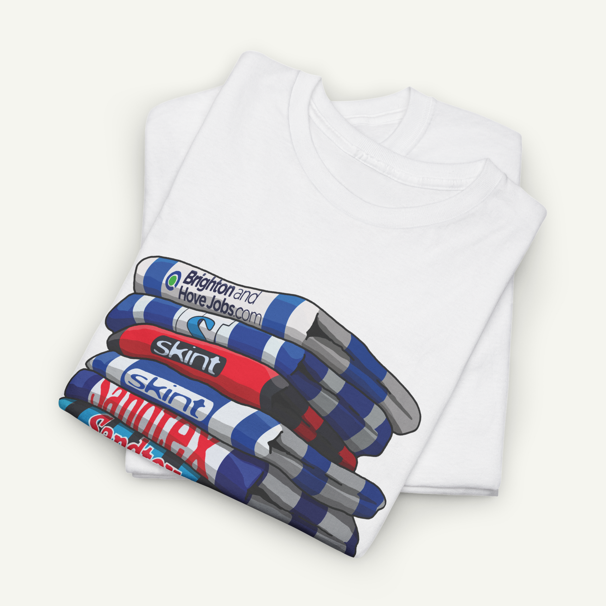 A white t-shirt with a graphic design depicting a stack of colorful markers or highlighters.