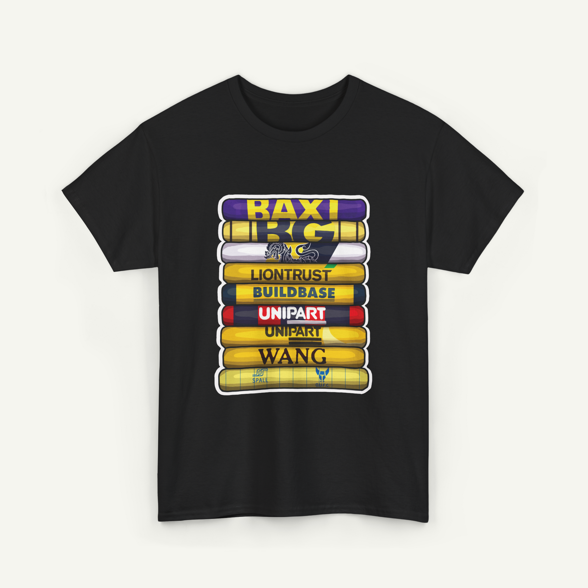 A black t-shirt with a graphic design featuring a stack of colorful books or tubes, each with a different word written on it.