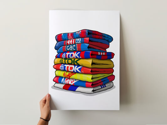 A hand is holding up a poster with a stack of colorful towels, each with a different brand logo printed on them.