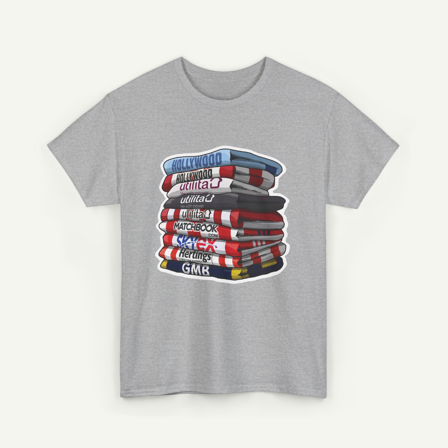 A gray t-shirt with a graphic design depicting a stack of colorful books or magazines.