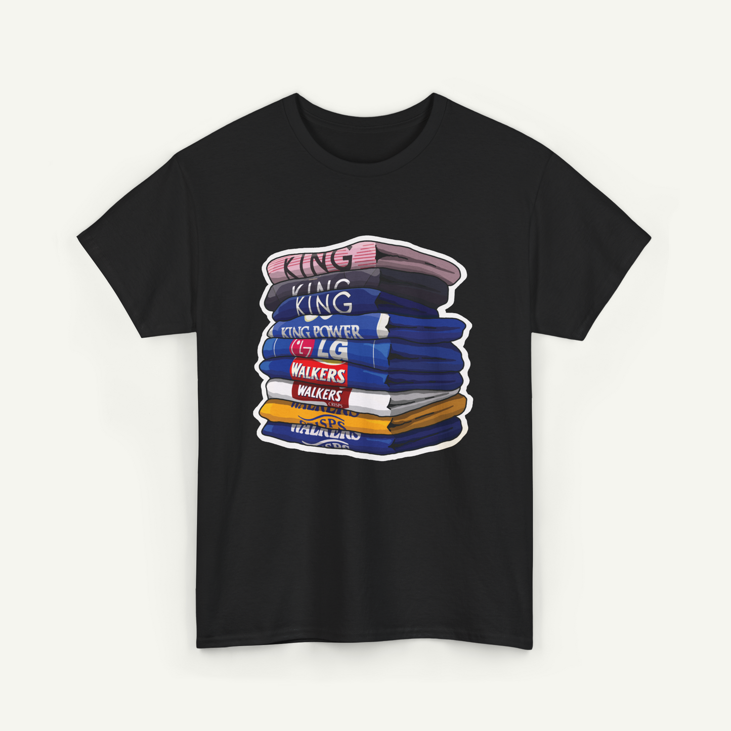 A black t-shirt with a graphic design depicting a stack of colorful books or books with the text "KING KING" written on them.