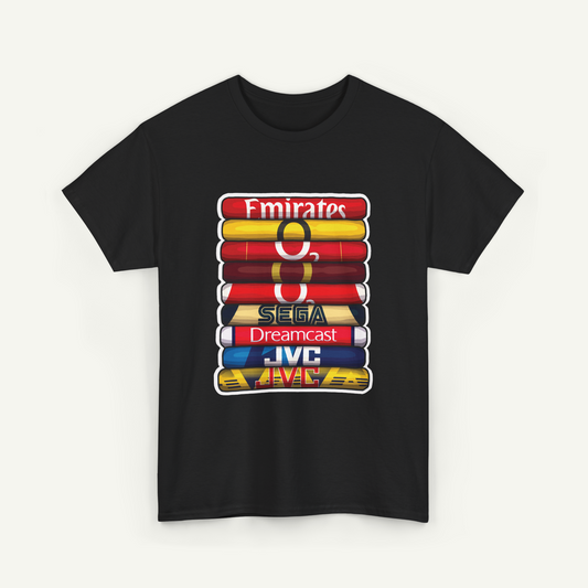 A black t-shirt with a graphic design featuring a stack of colorful books or magazines, each with a different logo or brand name printed on it.