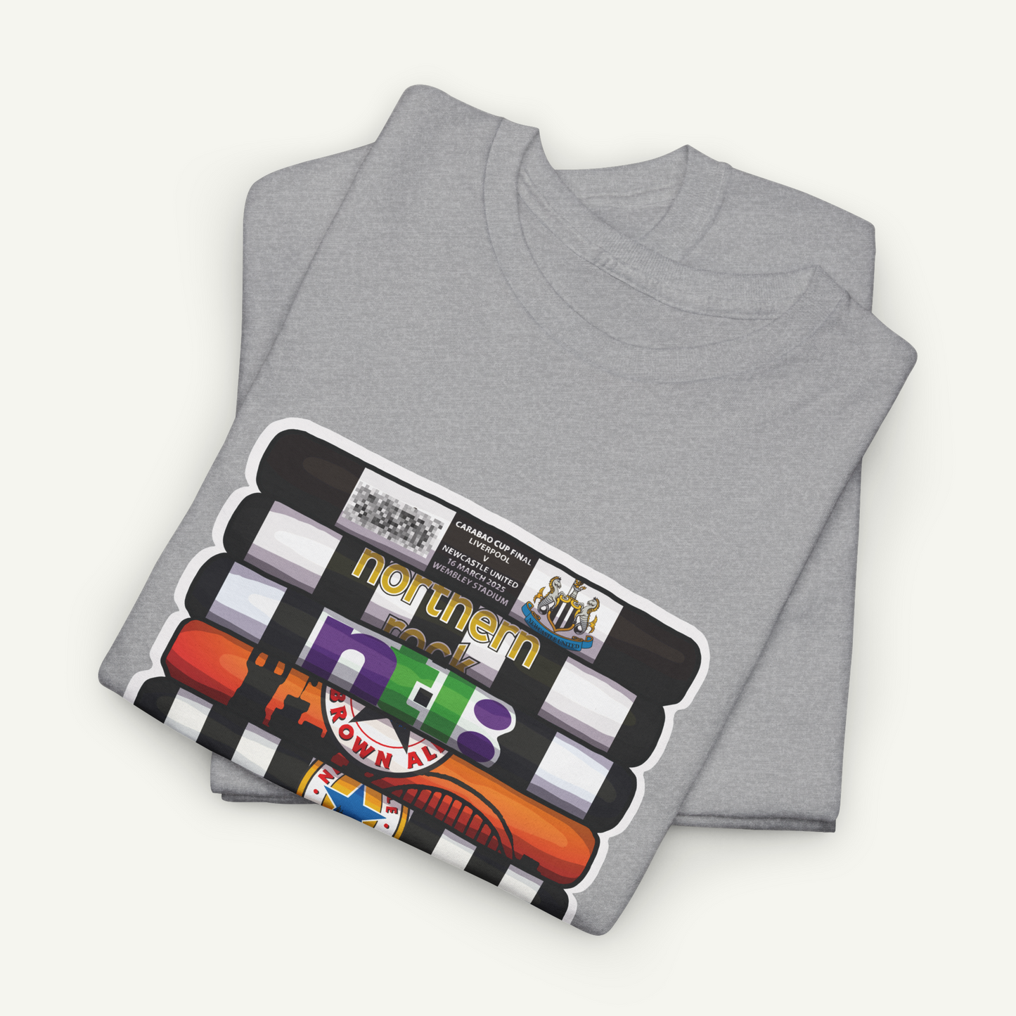 a gray t-shirt with a graphic design featuring a stack of colorful objects, including a red and orange striped object, a black and white striped object, and a yellow and black striped object.