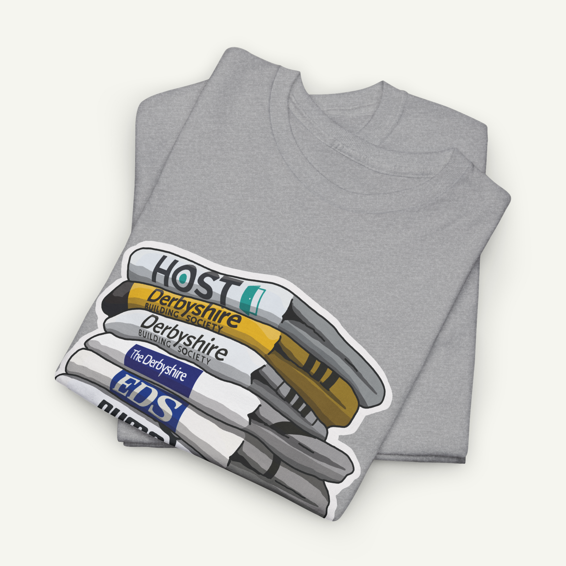 A gray t-shirt with a graphic design depicting a stack of books or magazines with the text "HOST" printed on them.