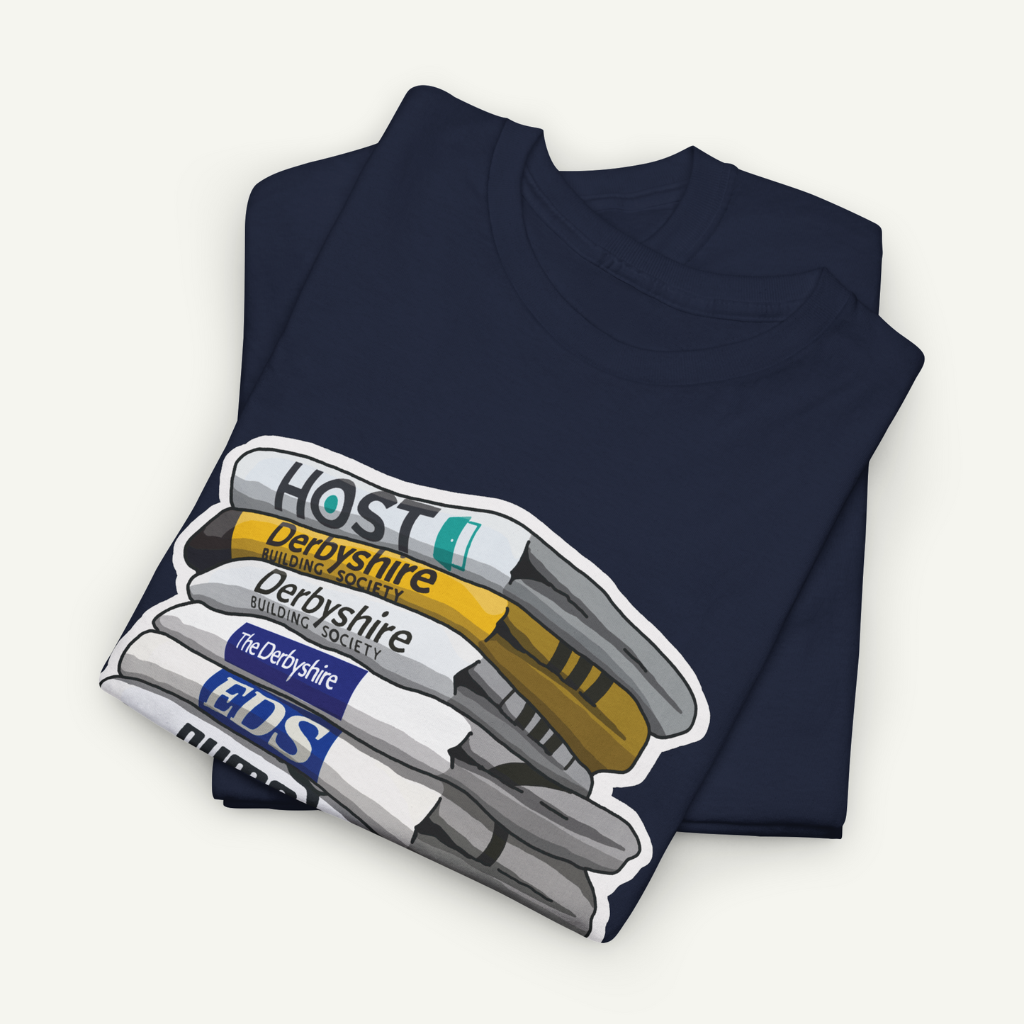 A dark blue t-shirt with a graphic design depicting a stack of markers or pens in various colors.