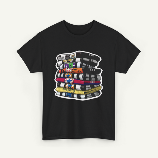 A black t-shirt with a graphic design depicting a stack of colorful books or magazines.
