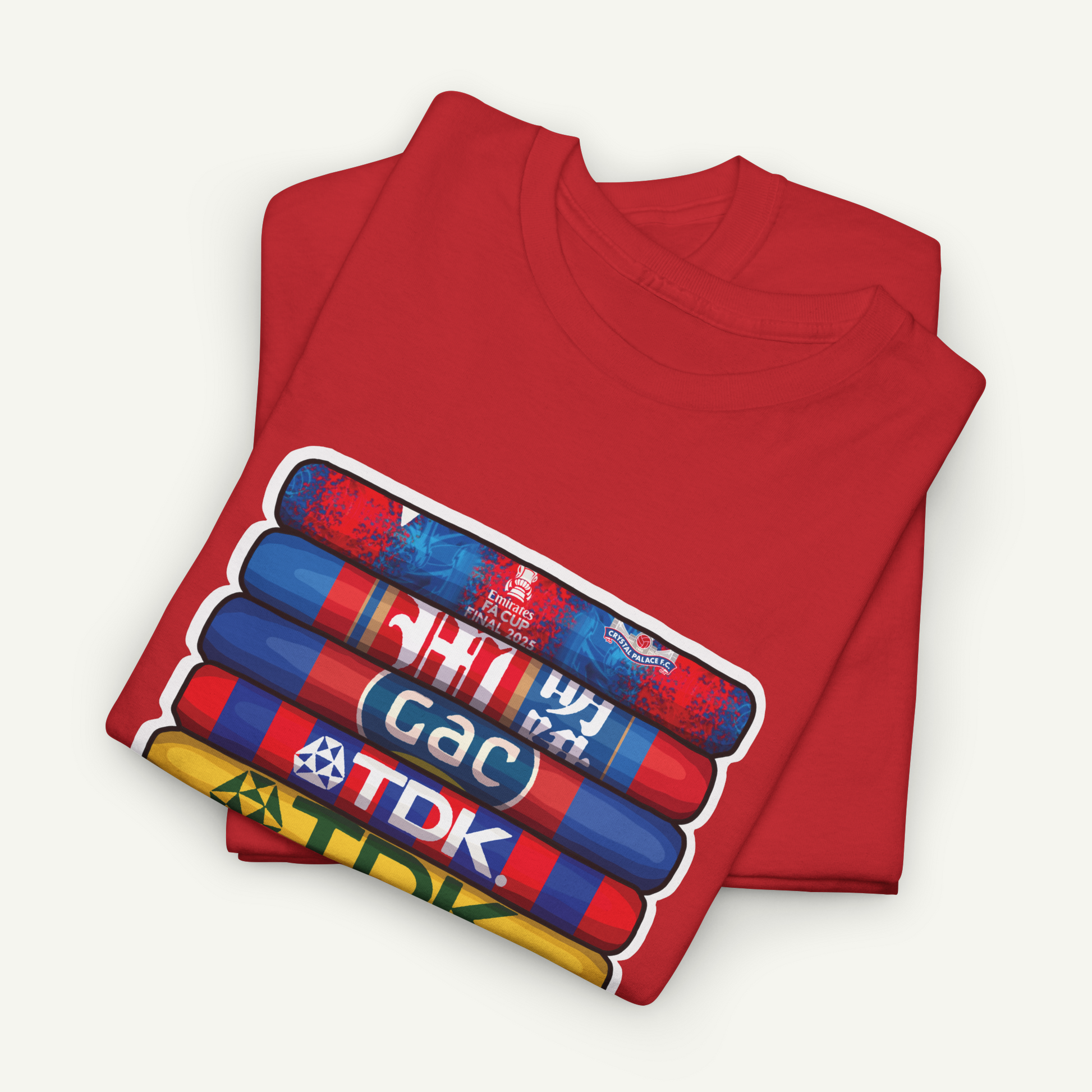 A red t-shirt with a graphic design featuring a stack of colorful tubes or cylinders with text on them.