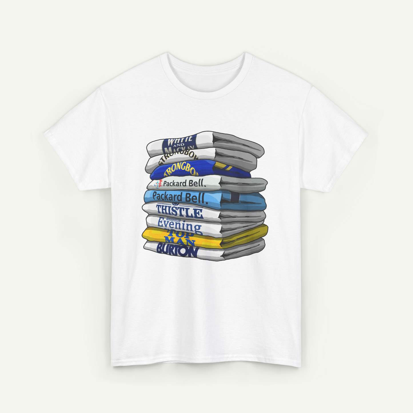 A white t-shirt with a graphic design depicting a stack of books or magazines with various titles and colors.