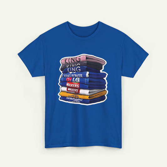 A blue t-shirt with a graphic design depicting a stack of books or books, with the text "KING KING" written on the top book.